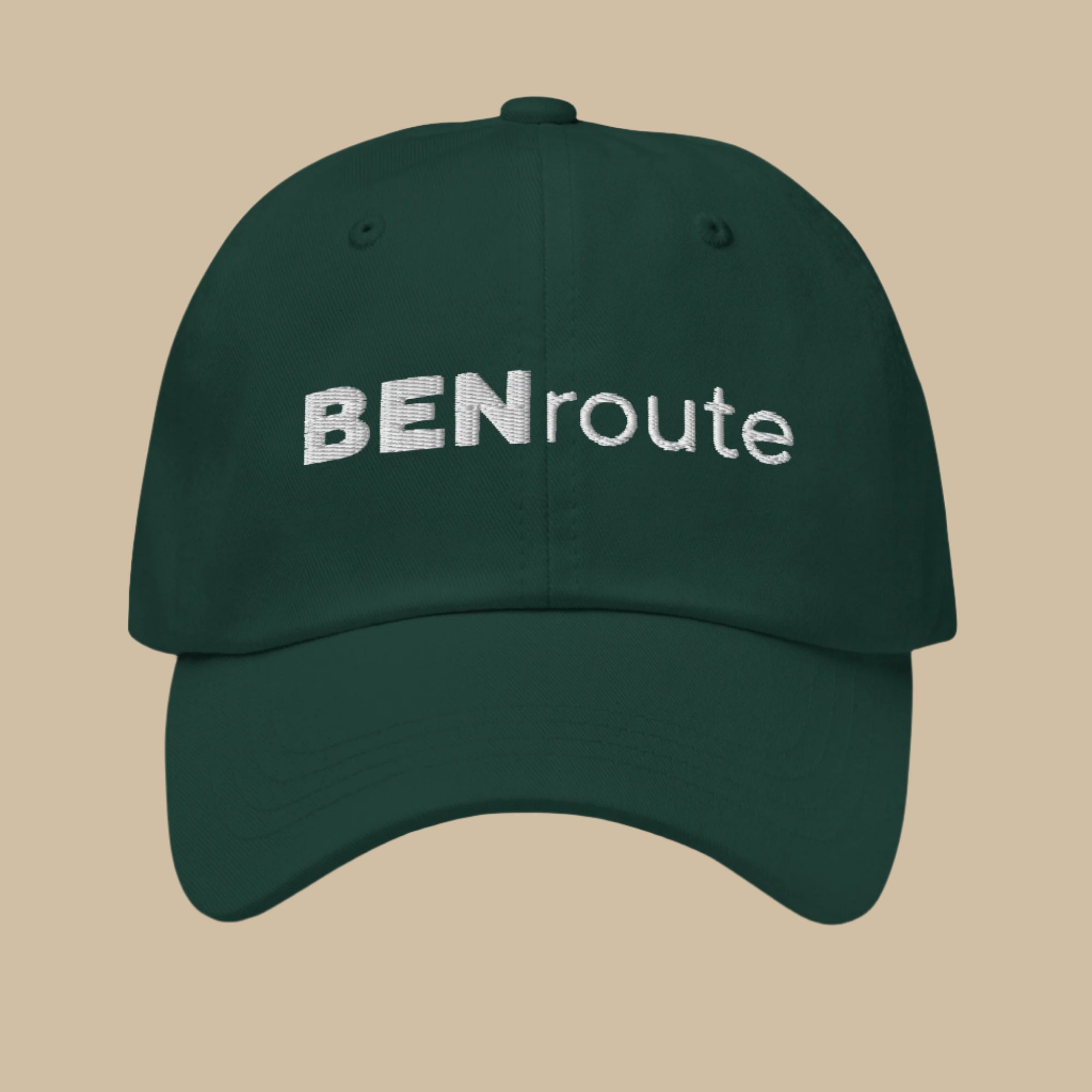 BENroute branded baseball caps collection featuring embroidered logo on adjustable dad hats in beige, forest green, white, and black - perfect custom merch for building creator brand recognition and fan loyalty