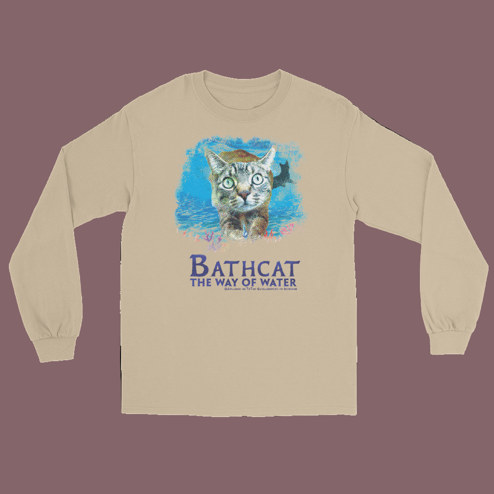 Beige long-sleeve shirt with a cat graphic and text on a white background