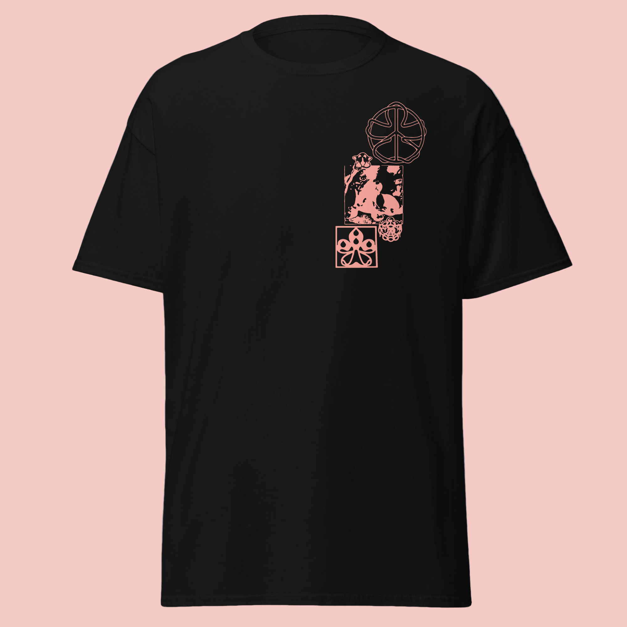 A black flat lay t-shirt with a salmon graphic in the top left corner. The design features an abstract puppy face and floral details.