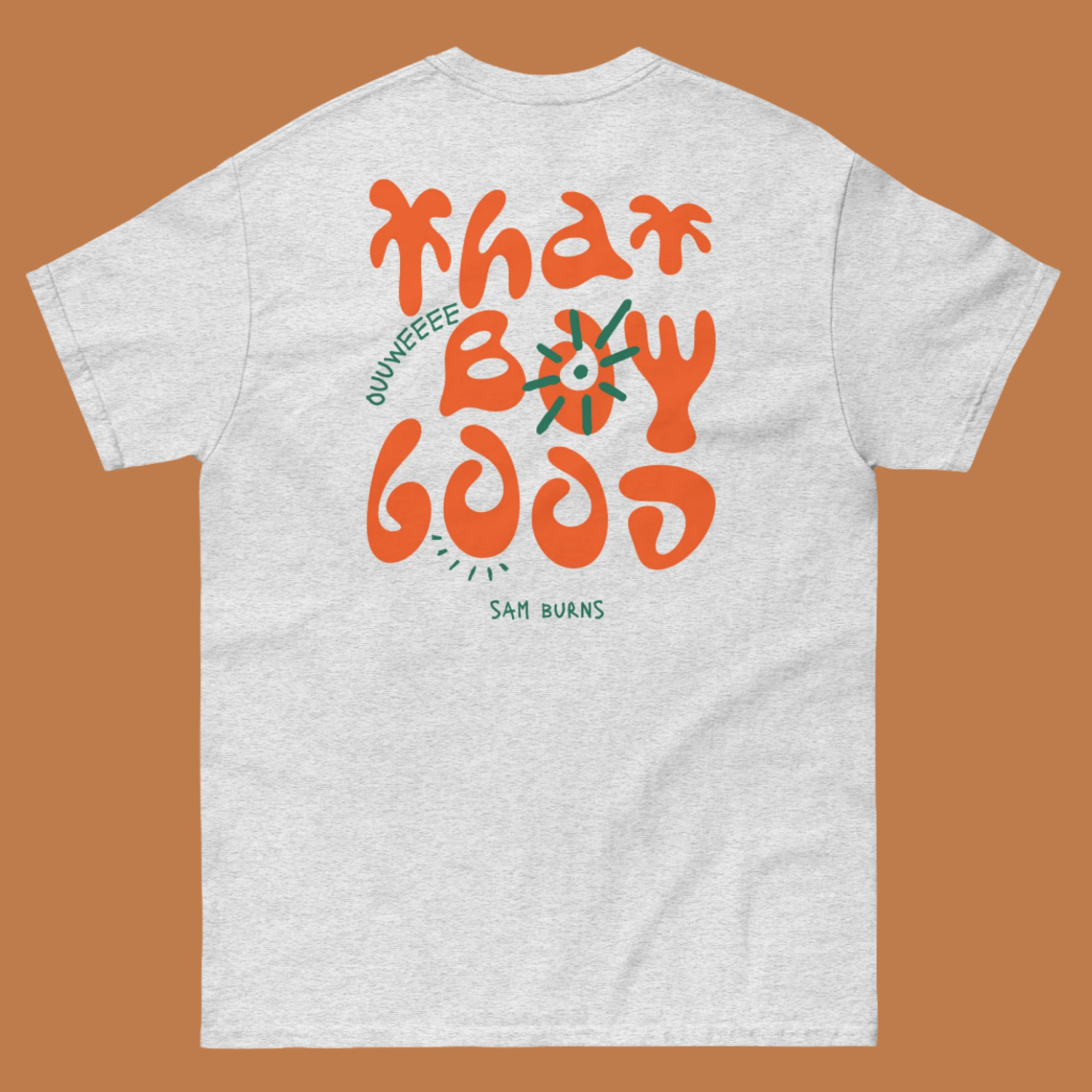 Sam Burns comedian merch featuring bold orange "That Boy Good" lettering on premium t-shirts - custom creator apparel perfect for building fan loyalty and comedy brand recognition